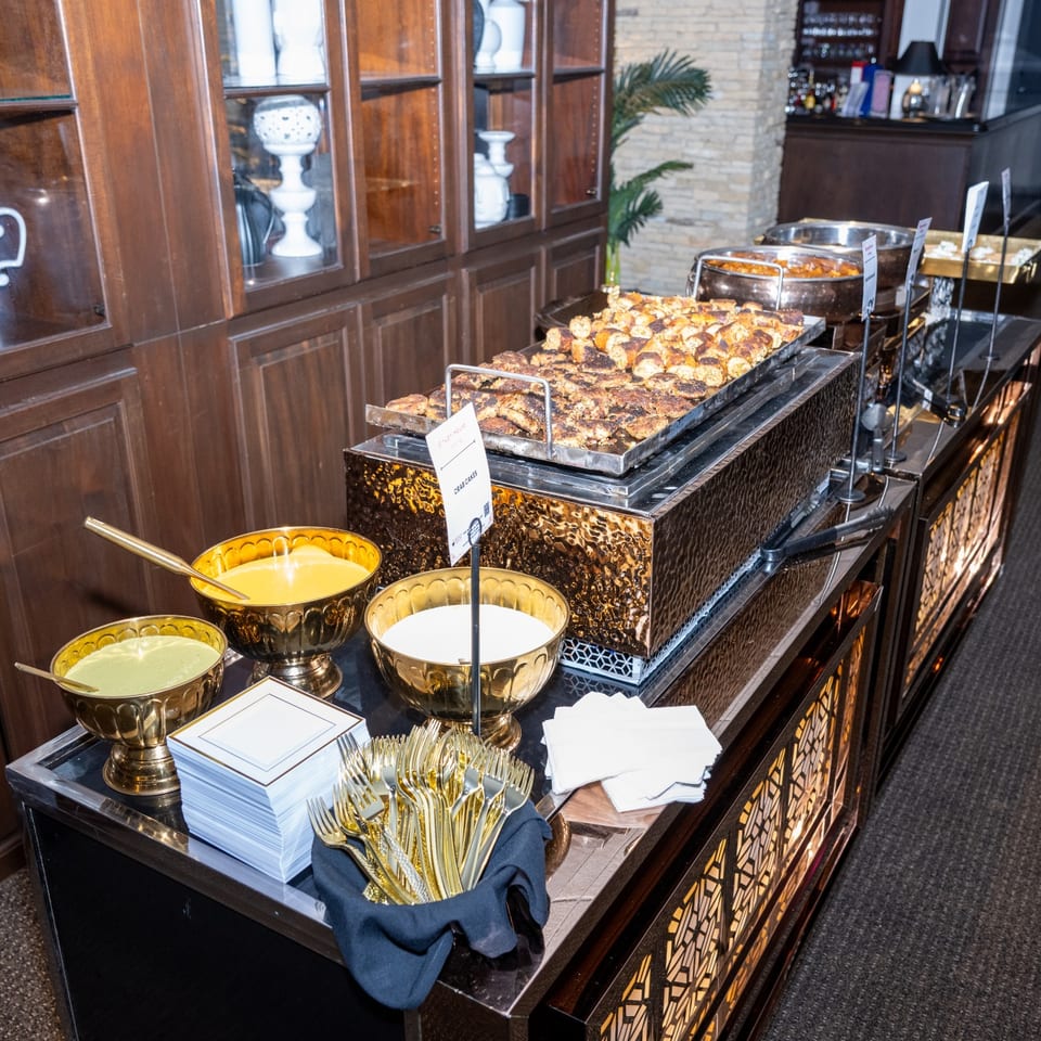 Catered appetizer buffet with sauces