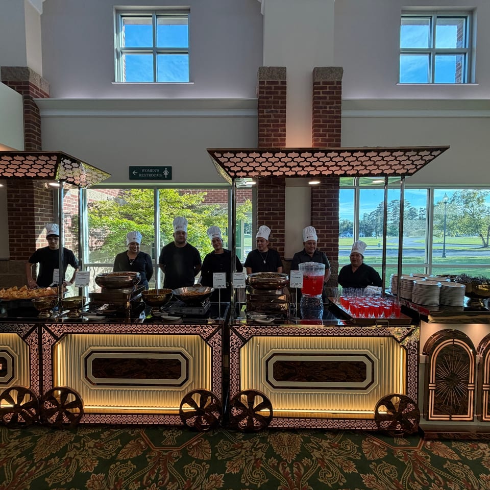 Catering chefs behind a chaat buffet