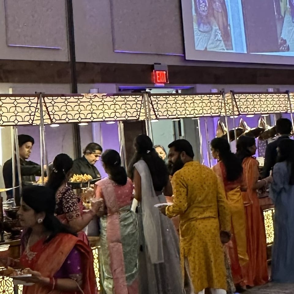 Guests enjoying catered food at an event